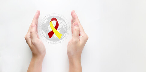 woman hand cover protect a Red and Yellow ribbon. World hepatitis day awareness month, 28 July, Liver cancer, Jaundice, Cirrhosis, Failure, Enlarged, Hepatic Encephalopathy and Health concept