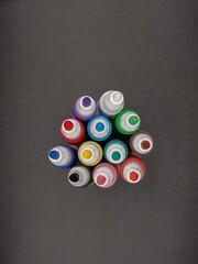 multi-colored markers on a gray background