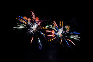 Montreal, Canada - June 27 2024: Fire works show with quarter moon in background at La Ronde in...