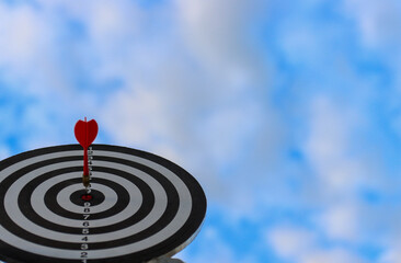 Dart board with red arrow for business planing and successful concept
