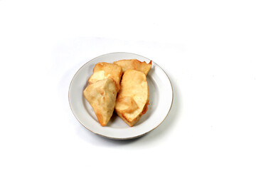Fried breadfruit is a food made from thinly sliced ​​breadfruit coated in a wheat flour mixture then fried until dry and crispy. Fried breadfruit isolated on white background.
