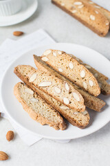 almond biscotti on a white plate, almond cantucci cookies on a white plate, biscotti cookies or twice baked cookies
