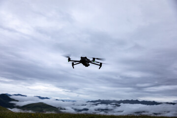 Drone flying on high altitude mountain top