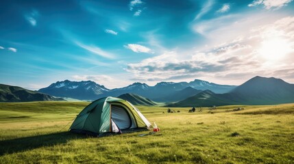 Big tent and camping equipment on grassy field with mountains and blue sky --ar 16:9 