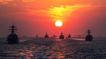 Naval Fleet Silhouetted Against a Fiery Sunset