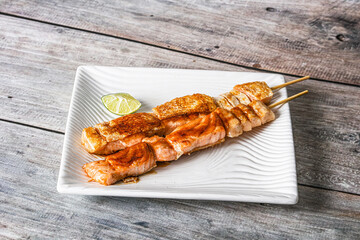 Grilled salmon skewer with sauce