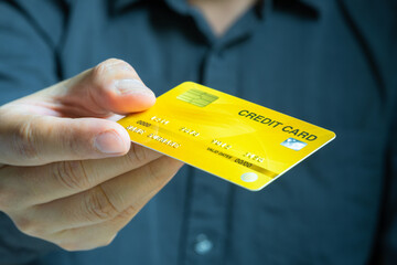 Man holdin credit cards and he is choosing a credit card to pay and spend Payment for goods via credit card. Finance and banking concept	