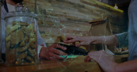 Image of digital interface over people using payment terminal