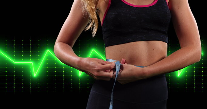 Image of cardiograph over caucasian woman measuring waist