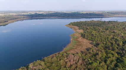 Aerial view of the reservoir dam and forest at a rural countryside