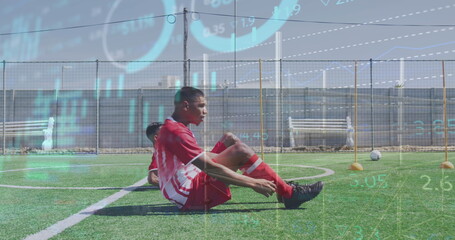 Image of multiple graphs moving over multiracial soccer players practicing crunches on field