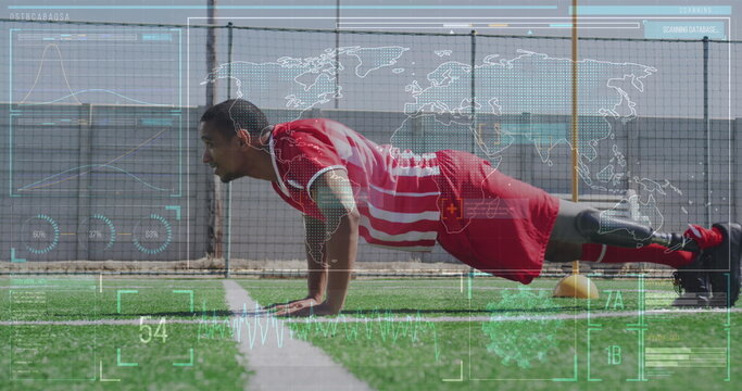 Image of screen with world map and data over biracial male soccer player doing push ups