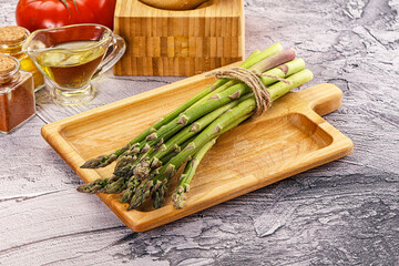 Vegan raw green asparagus heap