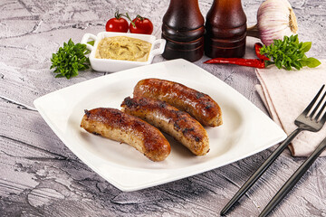 Delicous natural roasted sausages in the plate