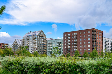 building in the city with various apartment blocks and apartment buildings with a green park in the foreground, Malmö, Sweden	
