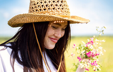 Portrait of dreamy woman with sunhat.