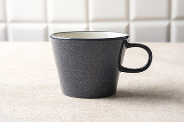 Empty beige grey coffee ceramic cup