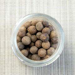 Jamaica pepper on white background, traditional spices. allspice close-up. selective focus, allspice.