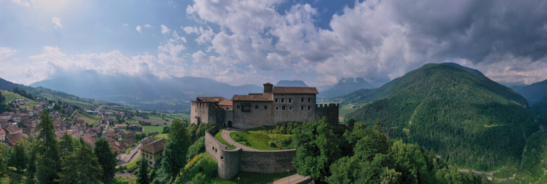 Stenico Castle in Trentino, Italy, with medieval architecture and stunning mountain views. Castle of Stenico (Trento, Trentino Alto Adige, Italy) at summer.
