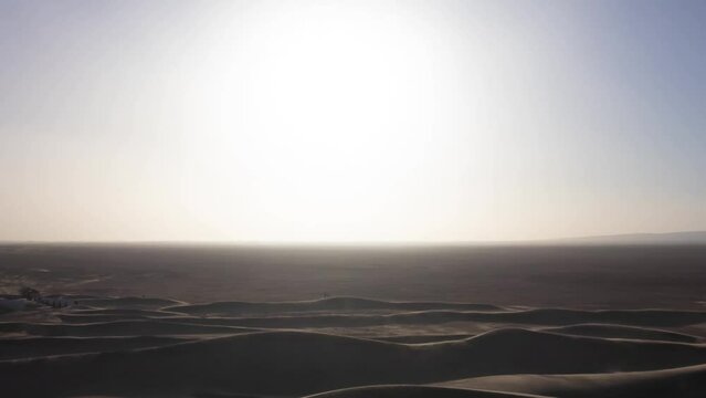 A dusk timelapse of sand dune at Mhamid el Ghizlane in Morocco zoom