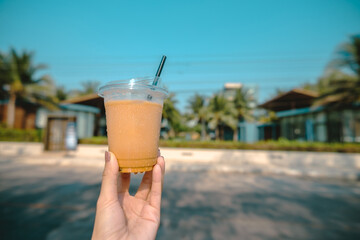 Close-up of Coffee and Toast on a Wooden Table with a Plant