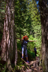 Women with backpacks hiking in the mountains