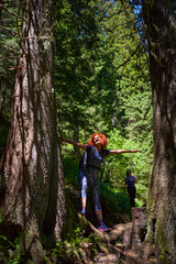 Women with backpacks hiking in the mountains