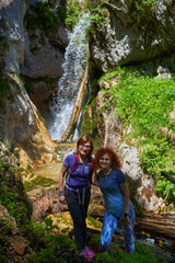 Women with backpacks hiking in the mountains