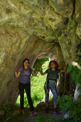 Women with backpacks hiking in the mountains