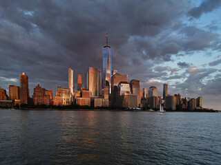 Obraz premium New York City top view. NYC aerial view, New York City Skyline with dramatic sky. Panoramic drone view on Manhattan in NY. Night in NYC. New York City Midtown skyline view at dusk with clouds.