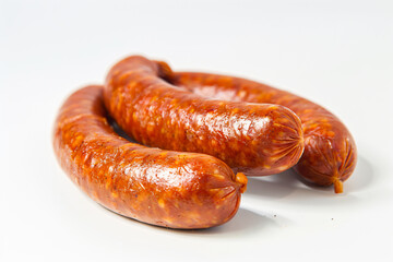 two sausages are sitting on a white surface