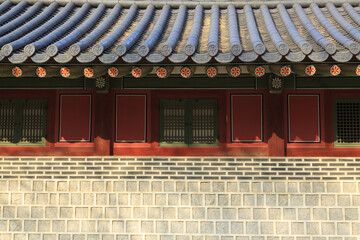 Front view of stone wall with window door and dancheong of tile house at Deoksugung Palace near Jung-gu, Seoul, South Korea
