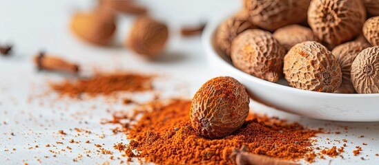 Kerala spices: A stunning mace of nutmeg, vivid orange, and aromatic, displayed on a white surface with copy space image.