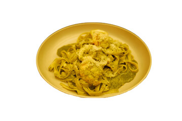 Isolated plate of Seafood Fettucine Pasta- Squid and Shrimp