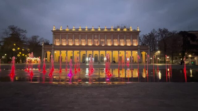 Reggio Emilia victory square bright colored fountains in front of the valli theater. High quality 4k footage