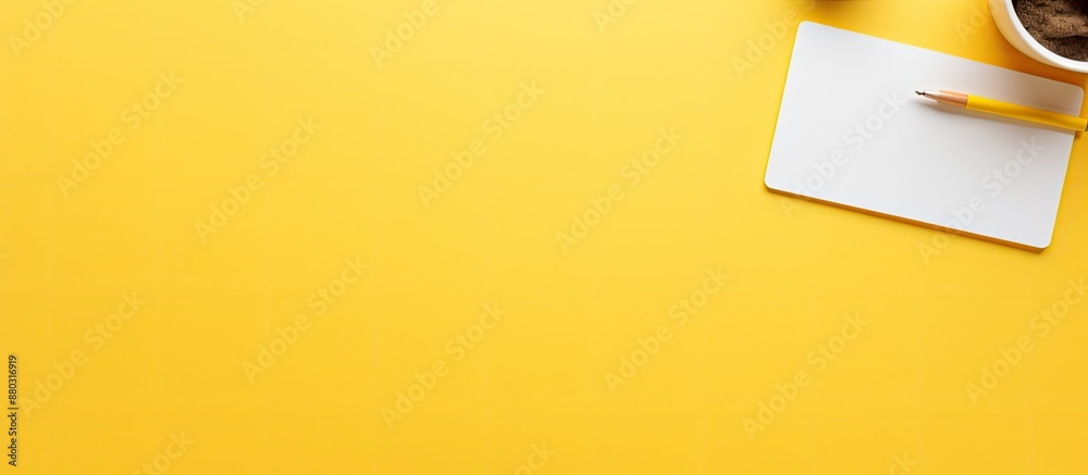 Aufkleber Yellow background with computer mouse, pens, felt-tip pens, and a notepad with KEEP IT SIMPLE text for a professional copy space image.