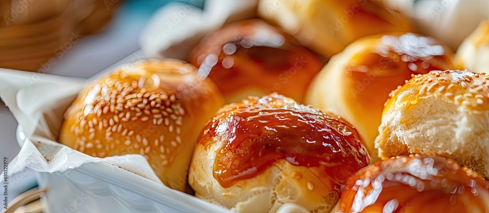 Poster Cheese buns with various fillings like dulce de leche and guava jam, neatly arranged in a white container with copy space image and selective focus.