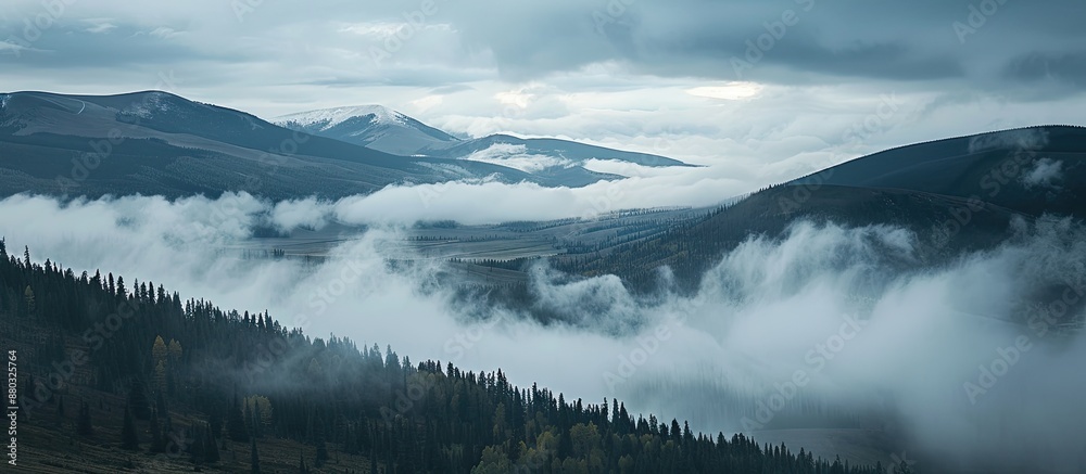 Poster Mountain landscape with copy space image featuring drifting low clouds.