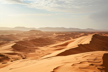Fototapeta premium Barren Sahara desert landscape with sand dunes under clear blue sky, A vast expanse of the Sahara desert with rolling sand dunes, AI generated