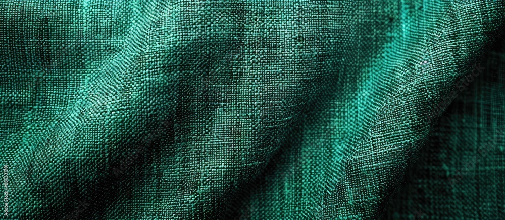 Poster green fabric with a detailed texture against a canvas background ideal for a copy space image
