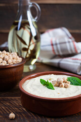 Eggplant hummus in a plate with basil. Chickpea dishes. Vegetarian food