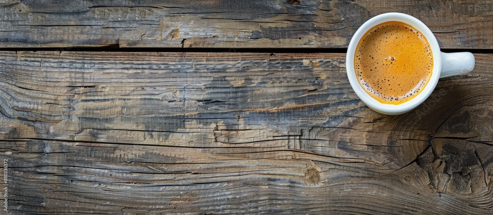 Fototapete top view of a cup of coffee displayed on a wooden surface with empty space for additional images