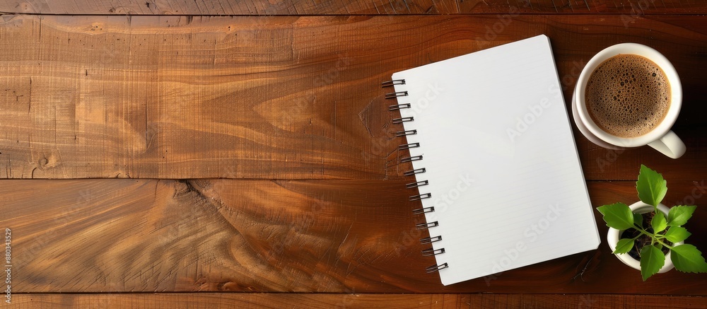 Aufkleber office desk with a blank notebook on a wood background perfect for showcasing a copy space image