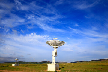 Radio telescope observatory and the blue sky white clouds