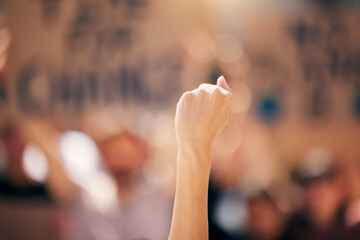 Fist, hand up or person in protest rally for government law, corruption or politics for freedom or empowerment. Human rights, equality or fighting global revolution for hope, world change or society