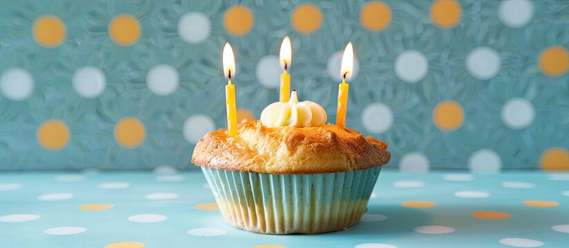 Birthday muffin pie adorned with candles on a festive background featuring the number 12 alongside an anniversary card against a blue polka dot backdrop ideal for a copy space image