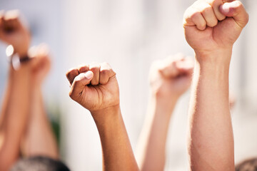 Hands, fist and people for protest with teamwork, human rights and diversity in collaboration with...