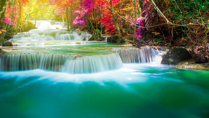 Amazing in nature, beautiful waterfall at colorful autumn forest in fall season
