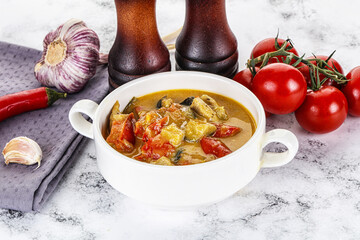 Traditional yellow Thai curry with chicken
