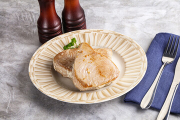 Roasted red tuna steak in the plate